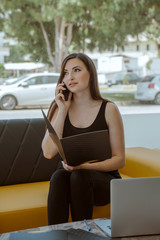 young business woman talking on mobile phone at office with document file folder.