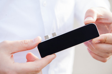 Man holding mini adapter for laptops and flash memory