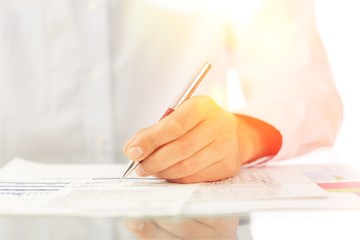Businessman is signing a contract, business contract details