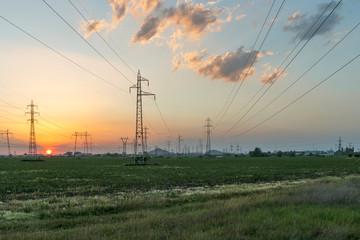 Amazing Sunset view over High-voltage power lines in the land around city of Plovdiv, Bulgaria