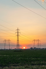 Amazing Sunset view over High-voltage power lines in the land around city of Plovdiv, Bulgaria