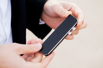 Man holding mini adapter for laptops and flash memory