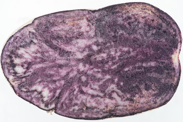 close up view of cut purple radish slice isolated on white