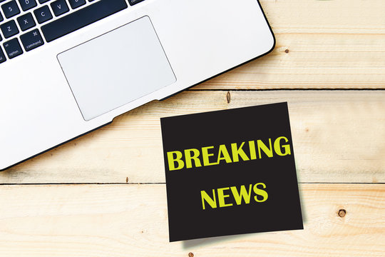 Conceptual hand writing showing Breaking News on black sticky note