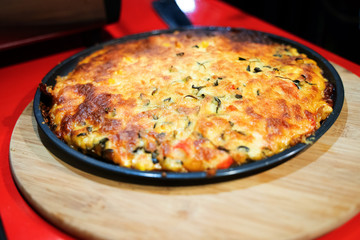 Custom made pizzas at home on appetizing brown wooden trays