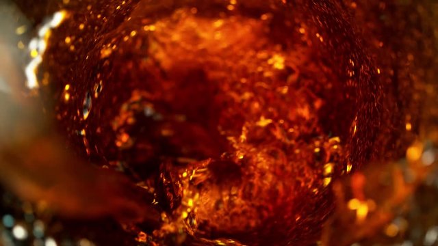 Super slow motion of pouring cola drink in twister shape. Filmed on high speed cinema camera, 1000 fps.