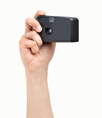 holding a compact camera