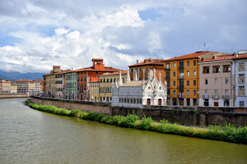 View of the medieval town of Pisa from bridge "Ponte di Mezzo" on river Arno