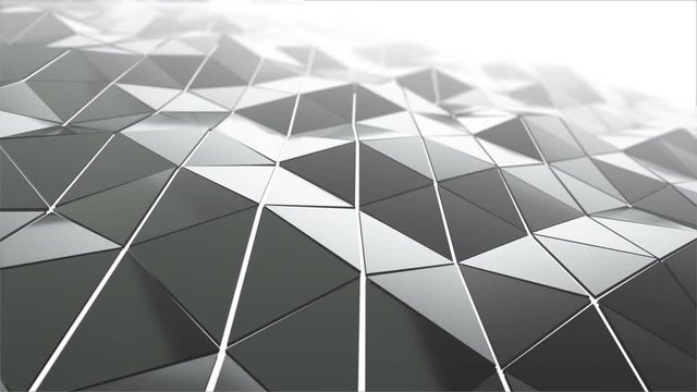 Abstract modern technology background with animation of waving smooth polygonal surface from glass, chrome or plastic with fog. Beautiful technological backdrop. Seamless loop 4k animation.