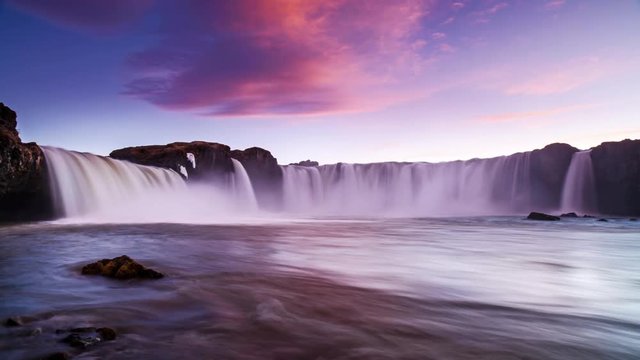 Sunset over beautiful waterfall   timelapse, godafoss Iceland