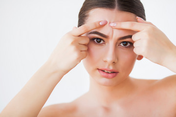 Fototapeta premium Problem Skin. Woman Crushing Spot On Face And Looking In Mirror