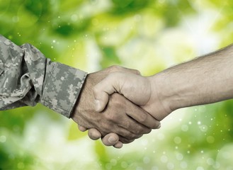 Business Agreement Handshake on background, close up