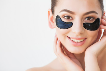 Skin Care Mask. Woman With Black Patches