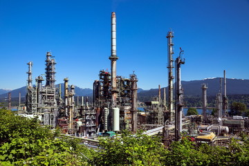 Oil refinery on a background of nature, Burrard Inlet and mountain view