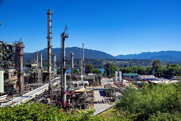 Oil refinery on a background of nature, Burrard Inlet and mountain view