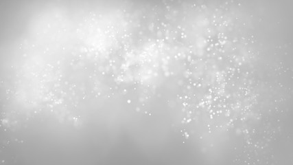 Glowing floating bokeh particles on gray colored background. Abstract soft snowing background