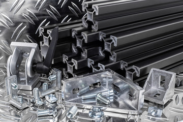 stack of black anodized aluminum extrusion bars, connector, joint, screw , slot nut and angle...