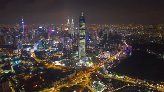 night time illumination kuala lumpur city downtown traffic aerial panorama 4k timelapse malaysia 