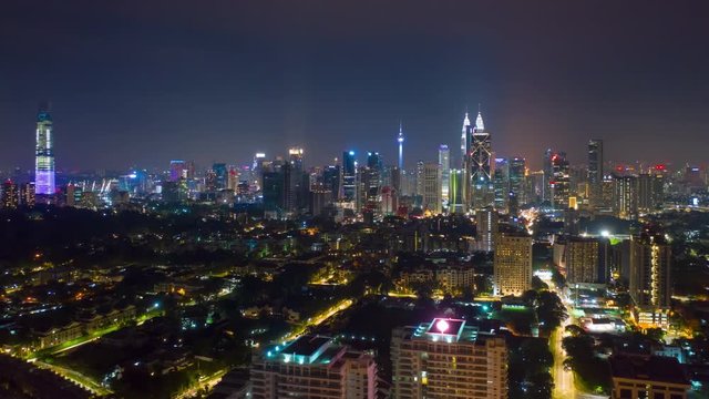 night time illumination kuala lumpur city downtown aerial panorama 4k timelapse malaysia 