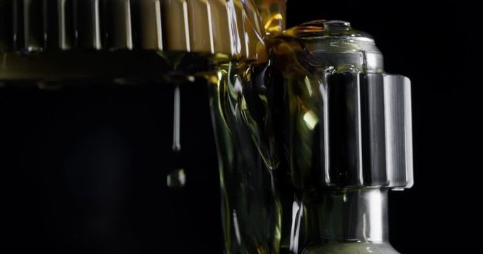 Slow motion macro of specialist is working on production of different gearing details in a workshop in industrial factory.