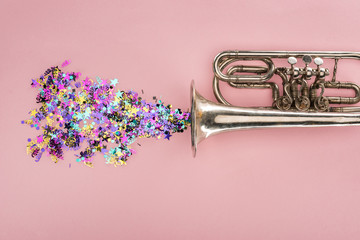 colorful confetti with trumpet on pink background - obrazy, fototapety, plakaty