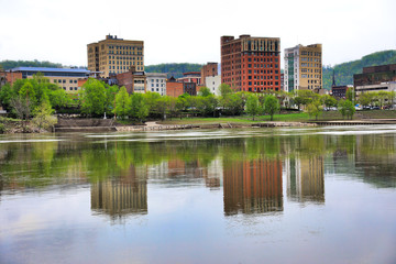 Fototapeta na wymiar The skyline of Wheeling, West Virginia is reflected in the Ohio River