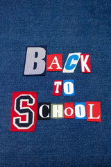 BACK TO SCHOOL text word collage, colorful fabric on blue denim, schools and education, vertical aspect