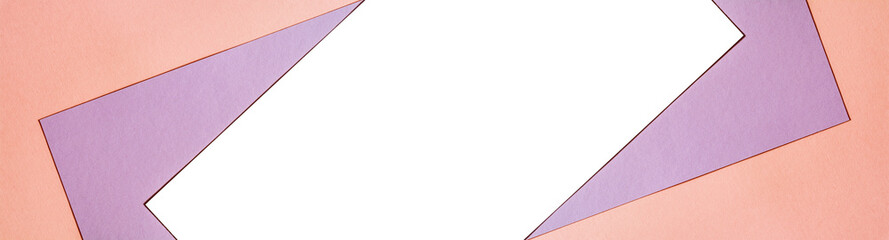 Multicolored paper background with trendy coral color of the year 2019 and a white isolated place for your text. Colorful paper with soft light trendy coral color and free isolated copy space.