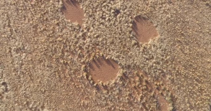 4K high circular zoom out aerial view of the famous fairy circles in the Namib desert,Namibia