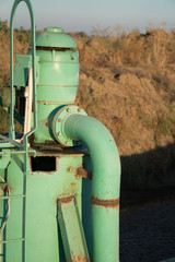 Old green electric agricultural water pump