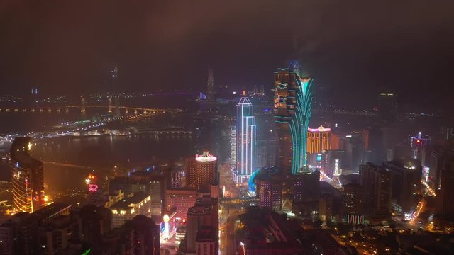 night time illumination macau city famous hotel area bay aerial panorama 4k china