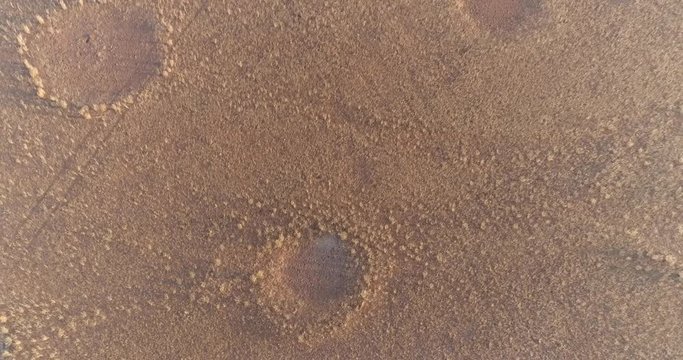 4K circular zoom out aerial view of the famous fairy circles in the Namib desert,Namibia
