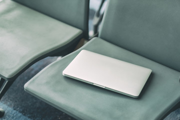 Passenger lost laptop computer on the airport chair