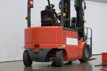 The forklift in the big warehouse.