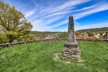 Moundsville, West virginia, just outside of Wheeling, is home to the Grave Creek Mound.  This historic landmark burial mound was built by the Arena people.