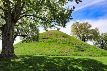 Moundsville, West virginia, just outside of Wheeling, is home to the Grave Creek Mound. This historic landmark burial mound was built by the Arena people.