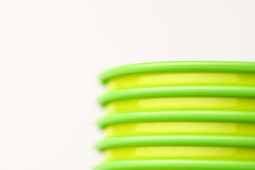 Close-up of cups that stand in each other on a white background. Horizontal photography