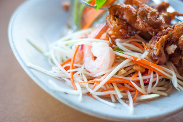 Thai spicy salad with shrimp street food: eating healthy food: delicious Thai sweet and sour spicy salad with soft shell crab