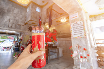 Hand woman holding fortune sticks teller box (Esiimsi, Seam-Si)