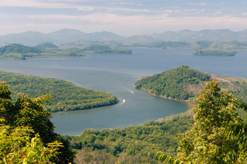 Fototapeta premium Aerial view on tropical landscape with Kra Buri river and mountains on horizon at Ranong province of Thailand. Khao Fa Chi viewpoint.