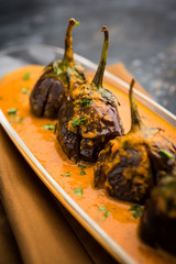 Baingan masala / Eggplant / brinjal curry served in bowl or pan, selective focus