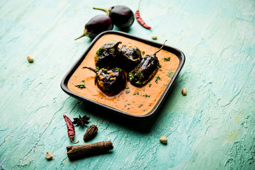 Baingan masala / Eggplant / brinjal curry served in bowl or pan, selective focus