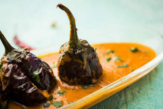 Baingan masala / Eggplant / brinjal curry served in bowl or pan, selective focus