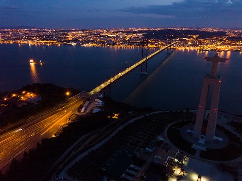 Lisbon and 25 de Abril Bridge at night, Portugal