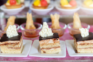 Collection of delicious dessert for party or wedding, gastronomy, event organization concept.