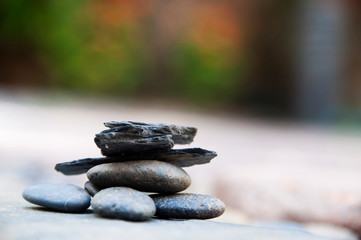 Fototapeta na wymiar Zen stone on beach for perfect meditation, stack of pebble stones on balance on sand, Pebbles and sand stone composition, Zen stones garden, pile of balanced stone