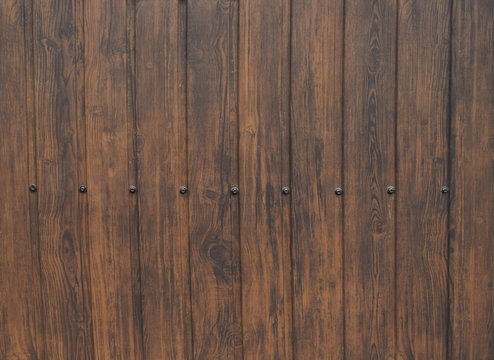 Wood texture background surface with old natural pattern. Wooden brown planks for house gate.