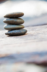 Zen stone on beach for perfect meditation, stack of pebble stones on balance on sand, Pebbles and sand stone composition, Zen stones garden, pile of balanced stone