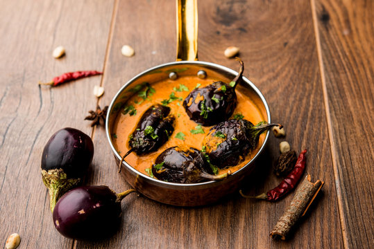 Baingan masala / Eggplant / brinjal curry served in bowl or pan, selective focus