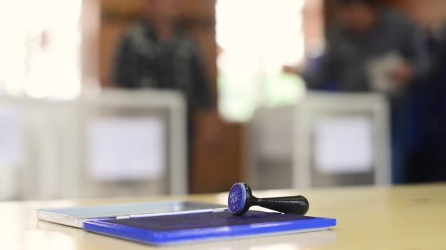 Close-up with a stamp in a polling station